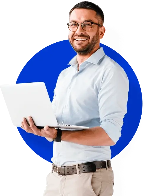 Confident man in smart casual attire holding a laptop.